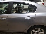 2010 Mazda Left Driver Side Rear Door Assembly Color: Silver 38P. Fixed Price $494.00.